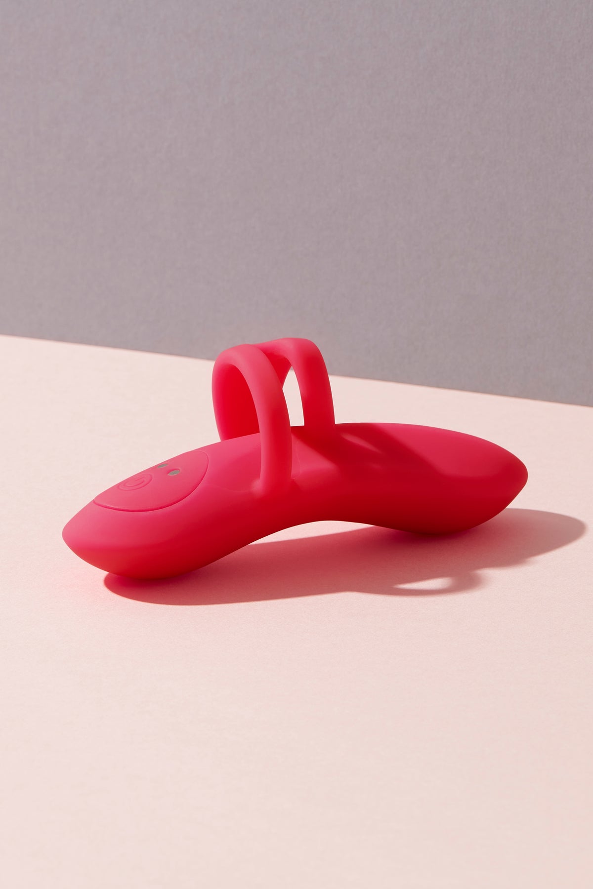 Bette finger vibrator on colour background