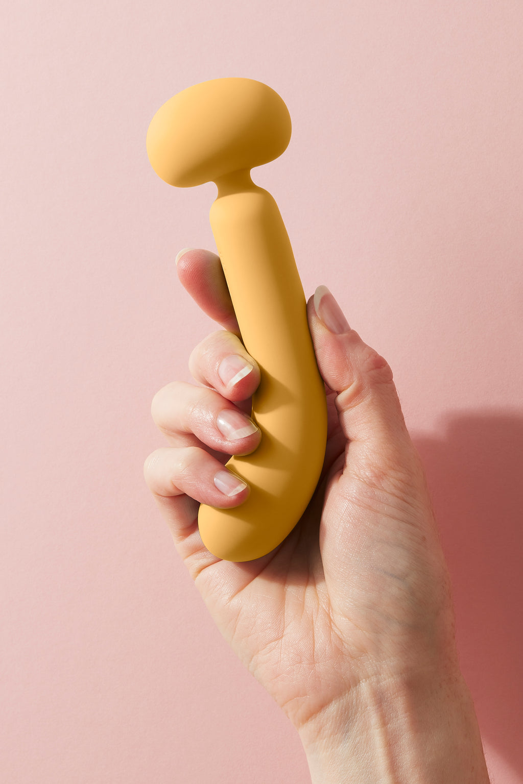 Wanda dual end vibrator held up to the side