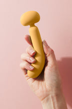 Wanda dual end vibrator held up to the side