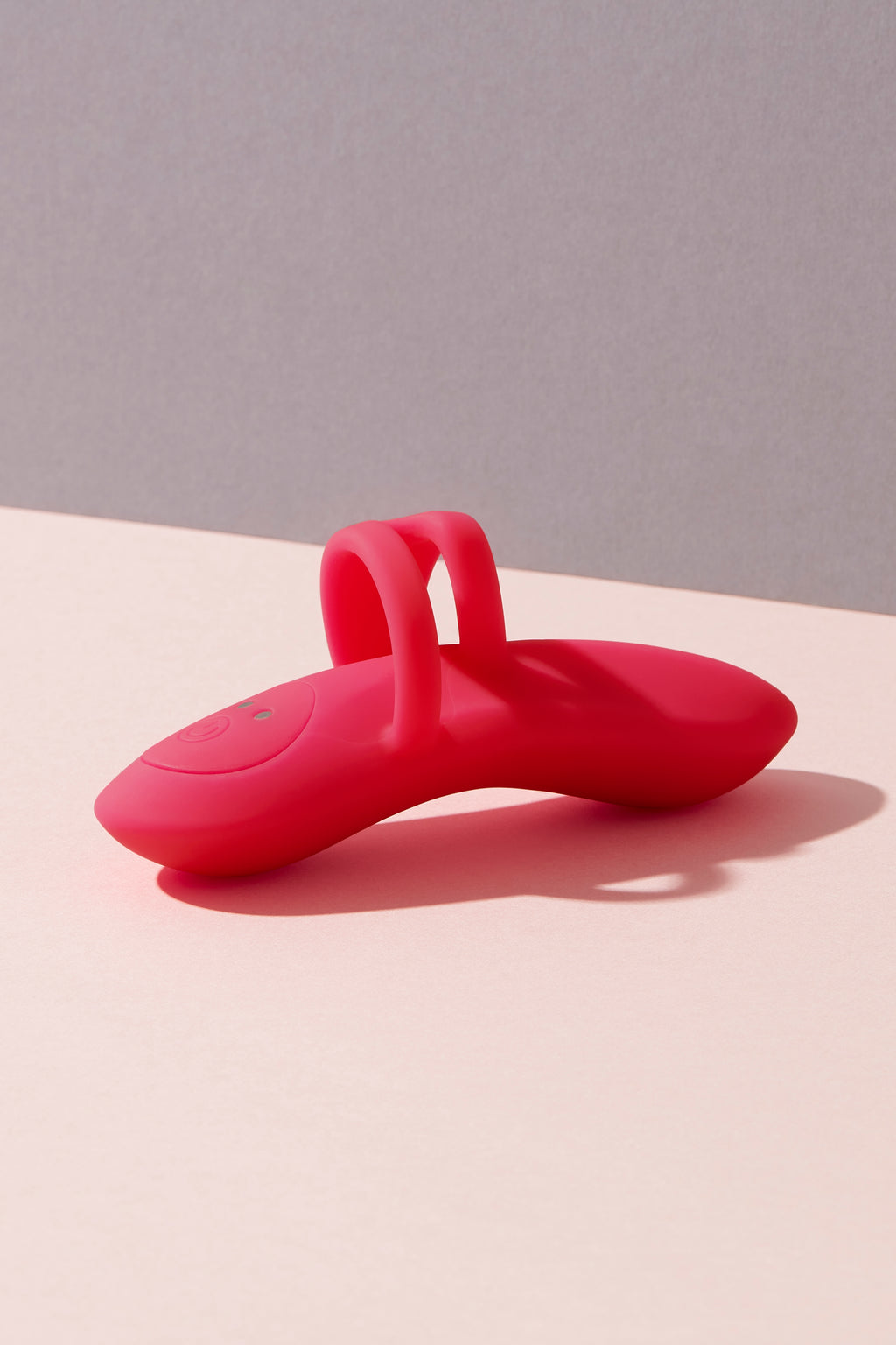 Bette finger vibrator on colour background